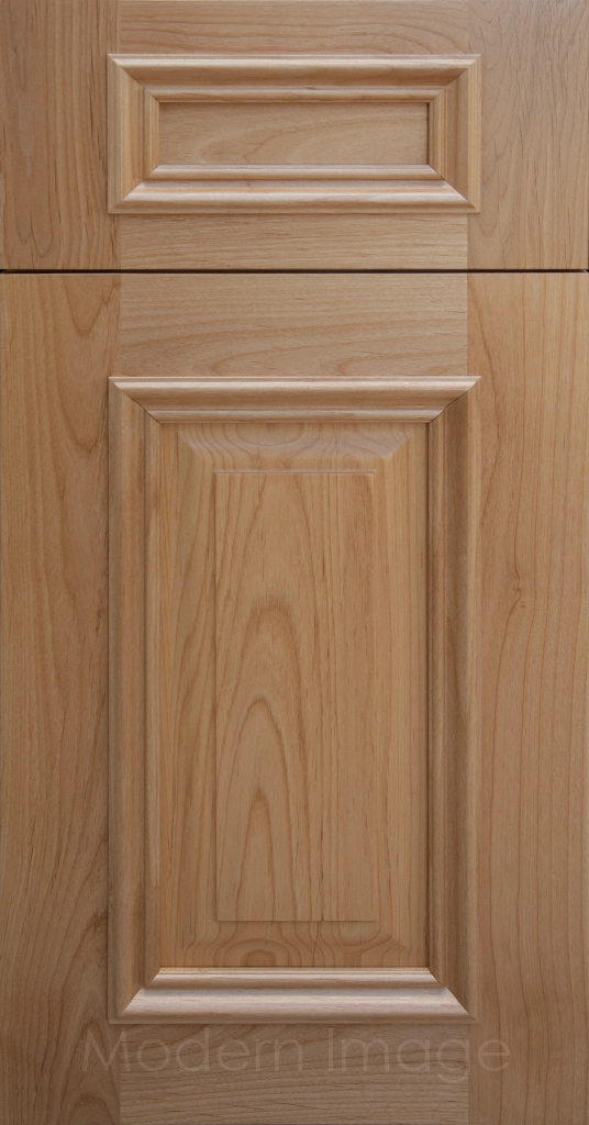Heritage custom cabinets in a Honey Stain, classic raised panel doors, and modern flat slab drawer fronts.